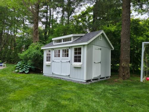 10-X-14-wood-garden-with-6-lite-doors-transom-dormer